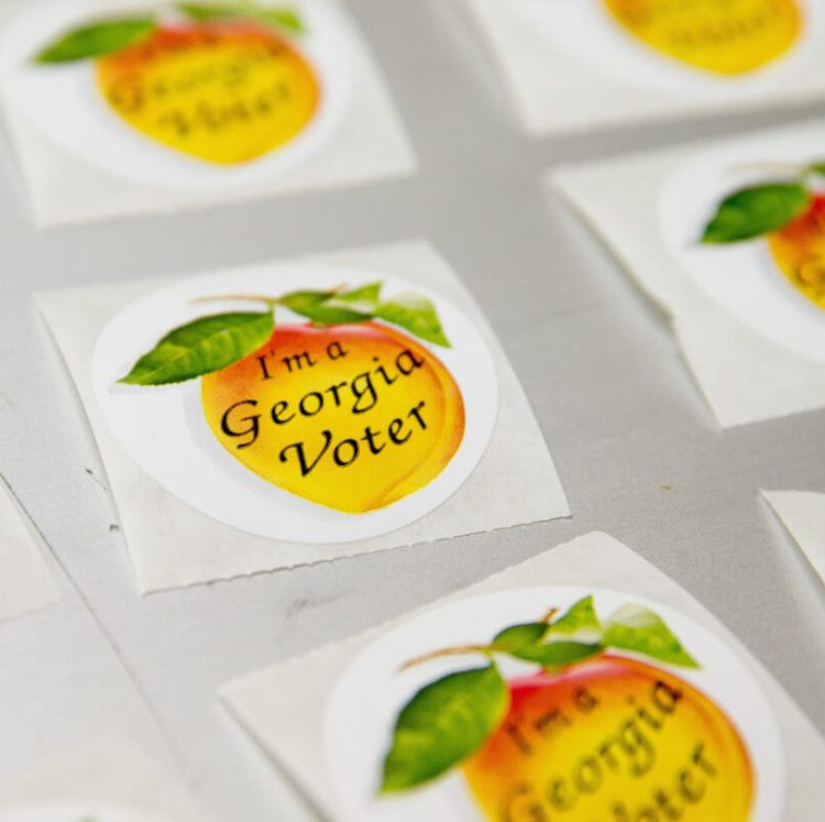 "I'm a Georgia Voter" stickers are layed out during Georgia's primary election at the polling station (AP Photo/Andrew Harnik)